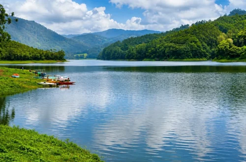 Mattupetty Dam lake surrounded by lush green hills in Munnar, Kerala